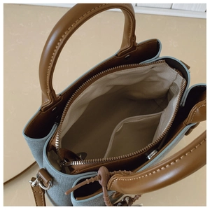 Top view of the spacious inner compartment with herringbone lining and silver zipper