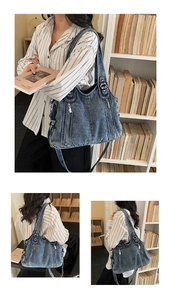Detail of vintage blue washed denim tote bag with zippers used in a library setting