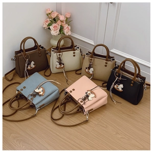 Showcase of six colorful faux leather handbags featuring detachable wooden horse charms