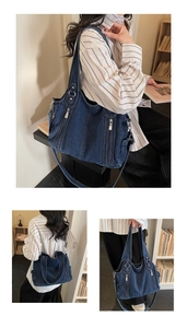 Detail view of large dark blue denim tote bag with silver zippers and multi-way straps