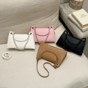 Chic leather underarm bags in white, pink, black, and tan with stylish chain handles