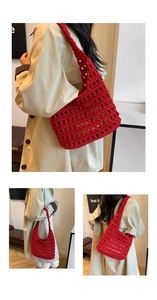 Detail of red hollowed-out crochet tote bag with handmade texture and wide shoulder strap