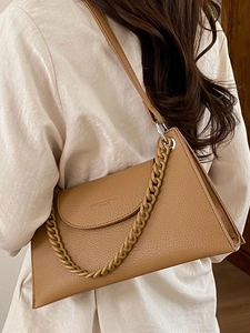 Minimalist brown lychee leather shoulder bag with resin chain detail for women