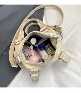 Interior view of beige tote bag showing large capacity for umbrella, phone, and cosmetics