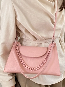 Pink lychee textured leather crossbody bag with chain strap and top handle fashion accessory