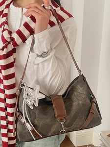 Retro washed grey underarm bag with contrast brown strap and metallic star heart charms