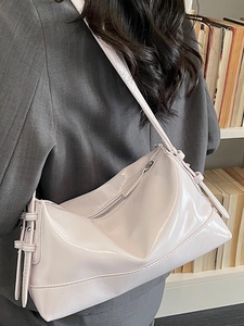 Glossy light pink lavender underarm bag with adjustable straps and metallic hardware