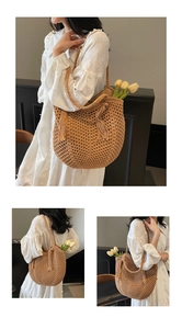Detail of hollow woven straw tote bag with long tassel and stylish crochet texture