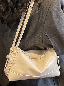 Minimalist beige underarm bag in soft leather with adjustable strap for women