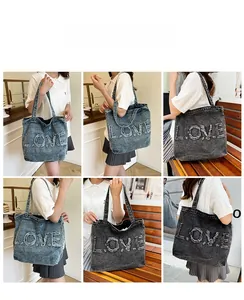 Detailed views of vintage denim tote bag with frayed LOVE letter embroidery in blue and grey