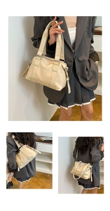 Close-up detail of beige leather tote bag stitching and versatile carrying styles