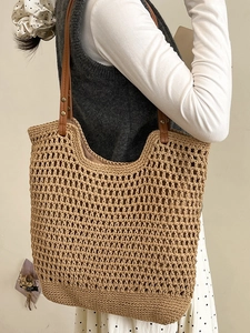 Handmade woven crochet tote bag with brown faux leather straps and khaki mesh pattern