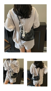 Women black hobo shoulder bag with pearl bow pendant, stylish retro commuting dumpling bag.