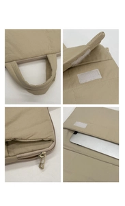 Detail view of beige quilted laptop bag with padded handles and velcro closure