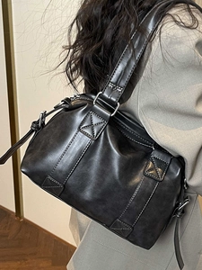 Vintage black Boston tote bag with white contrast stitching and silver zipper detail