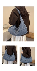 Close-up of corduroy hobo tote bag with ribbed texture and stitch details on strap