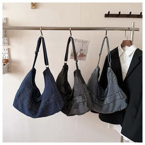 Detailed comparison of hobo bags in corduroy, checkered, and denim fabrics on display
