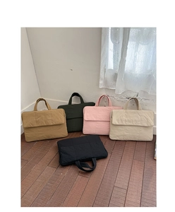 Detailed collection of quilted fabric laptop handbags in five diverse minimalist colors