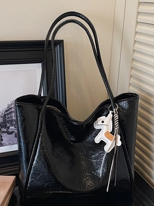 Minimalist black large capacity tote bag with glossy finish and a small horse charm