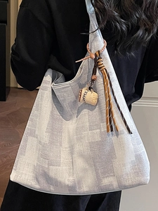 Light blue textured canvas hobo bag with cute coffee cup pendant and tassel