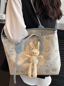 Minimalist large tote bag with blue graffiti print and cute rabbit pendant charm