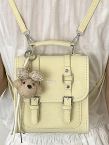 Minimalist cream yellow PU leather square crossbody bag with teddy bear charm decoration