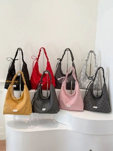 Collection of tote bags with ruffled straps in various colors and floral patterns