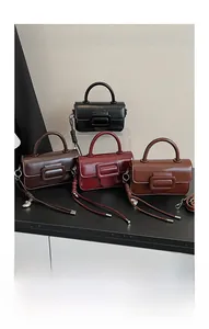 Minimalist square flap handbags in four colors with buckle detail and woven shoulder straps