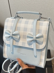Elegant light blue plaid crossbody bag with bows and structured top handle for women