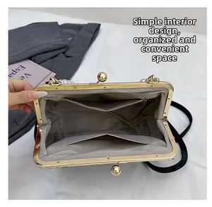Interior view of marble pattern evening bag with dual pockets and gold clasp