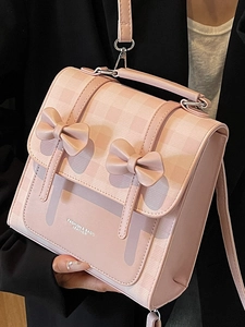 Pink bow-knot school style backpack and crossbody bag for women in stylish faux leather