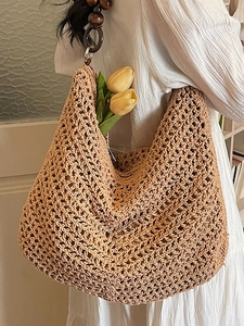 Handcrafted oatmeal crochet tote bag with wooden bead straps for beach vacations