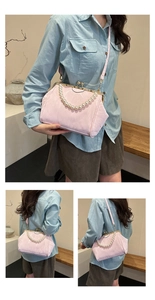 Pink shell bag detail with pearl handle, vintage clasp and detachable leather shoulder strap