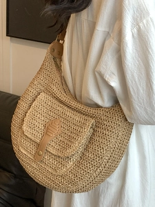 Straw half-moon shoulder bag with brown leather trim and large capacity for beach travel