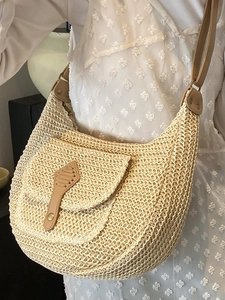 Beige straw woven hobo bag with brown leather details for women summer beach vacation