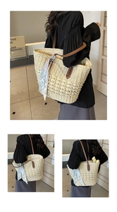 Detail of hand-woven straw tote with leather handles and decorative floral silk scarf