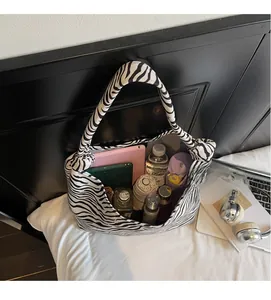 Interior view of zebra print canvas tote bag showing large capacity for essentials
