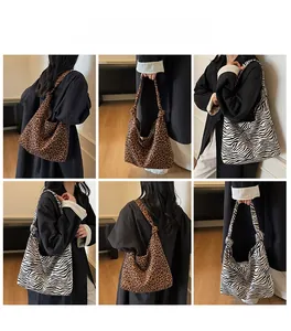 Detailed view of leopard and zebra print hobo bags with stylish knotted shoulder straps