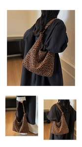Close-up of leopard print canvas bag featuring adjustable knotted shoulder strap details