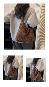 Detail of the zebra print canvas hobo bag showing the unique knotted strap design