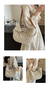 Detailed view of handmade woven tote bag featuring pearl handle and brown leather straps