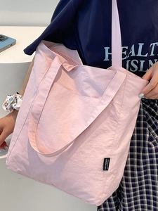 Pink nylon tote bag with crinkled texture and Yes Honey label for casual daily wear