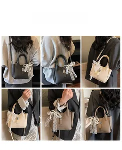 Detail shots of the stylish bucket bag showing lace bow charm and crossbody strap