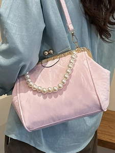 Chic pink pleated fabric shell bag with pearl handle and vintage metal clasp closure