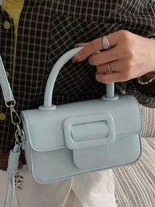 Minimalist light blue square handbag with top handle and silver heart charm decoration