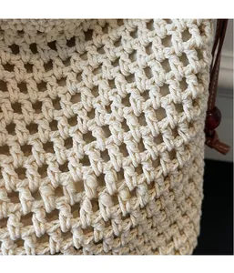 Detailed macro shot of hollow-out straw weaving texture and leather strap accents