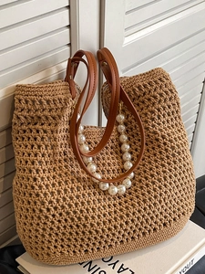 Artistic handmade straw tote bag with brown leather straps and pearl chain decoration