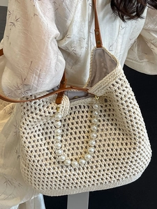 Handmade crochet tote bag with pearl handle and brown leather strap in cream white