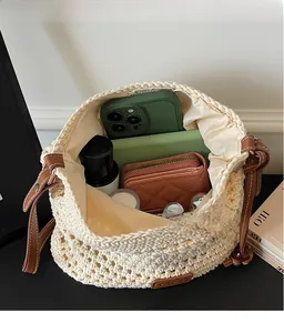 Interior view of beige woven tote bag showing large capacity for phone and cosmetics