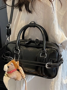 Glossy black bowling handbag with silver hardware and a cute plush horse charm for women